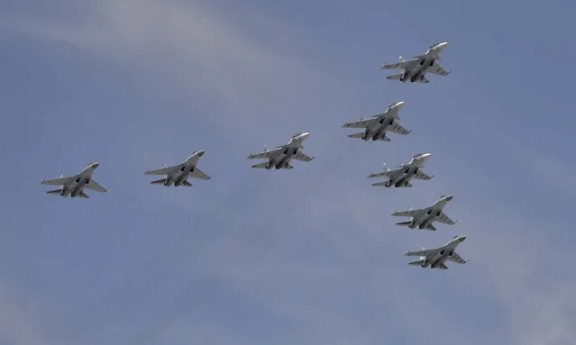 Sukhoi Su-30SM Flanker-C fighters and Su-35S Super-Flanker fighters fly in formation over the Red Square during the Victory Day parade in Moscow, Russia, May 9, 2015. (Photo by Reuters/Host Photo Agency/RIA Novosti)