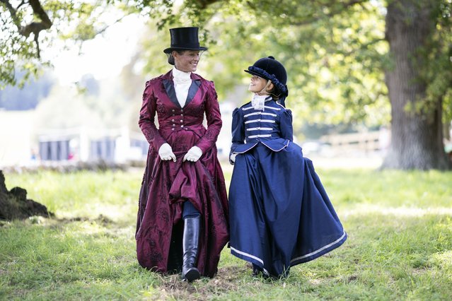 A mother and daughter Side Saddle Display team stroll through the grounds after their display on the last day of the Blenheim Palace International Horse Trials in Woodstock, England on September 19, 2021. (Photo by David Hartley/Rex Features/Shutterstock)