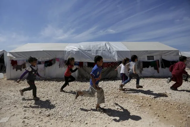 Internally displaced children run inside a refugee camp in Dana town after fleeing Palmyra, in northern Idlib province, Syria April 2, 2016. (Photo by Khalil Ashawi/Reuters)