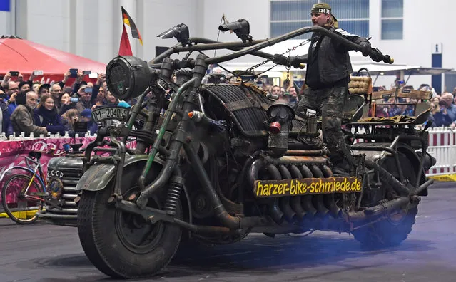 A giant, so called “Tank Bike”, driven by an engine of a T55 tank and constructed of former military equipment is pictured at a bike fair in Hamburg, Germany, February 25, 2017. (Photo by Fabian Bimmer/Reuters)