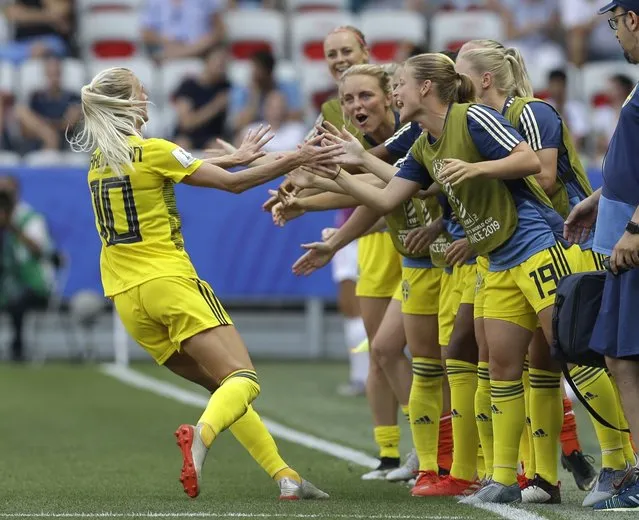 Sweden's Sofia Jakobsson, left, celebrates after scoring her side's second goal during the Women's World Cup third place soccer match between England and Sweden at Stade de Nice, in Nice, France, Saturday, July 6, 2019. (Photo by Claude Paris/AP Photo)