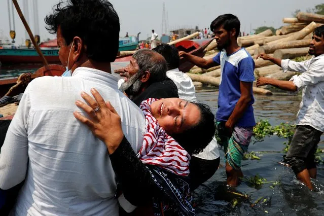 Relatives mourn after several people died as a ferry collided with a cargo vessel and sank on Sunday in the Shitalakhsyaa River in Narayanganj, Bangladesh, April 5, 2021. (Photo by Mohammad Ponir Hossain/Reuters)