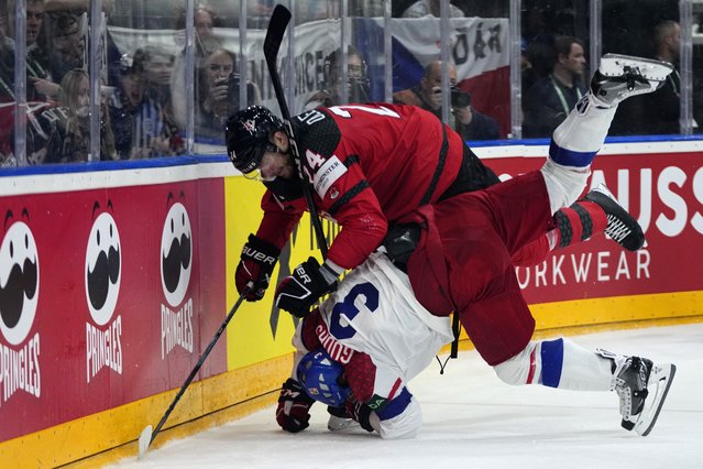 Canada's Jamie Oleksiak, up, checks Czech Republic's Radko Gudas during the preliminary round match between Czech Republic and Canada at the Ice Hockey World Championships in Prague, Czech Republic, Tuesday, May 21, 2024. (Photo by Petr David Josek/AP Photo)