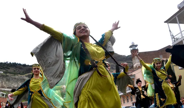 Members of the Azeri diaspora in Georgia wearing traditional costumes dance as they celebrate Nowruz in Tbilisi on March 21, 2017. Nowruz, “The New Year” in Farsi, is an ancient festival marking the first day of spring. (Photo by Vano Shlamov/AFP Photo)