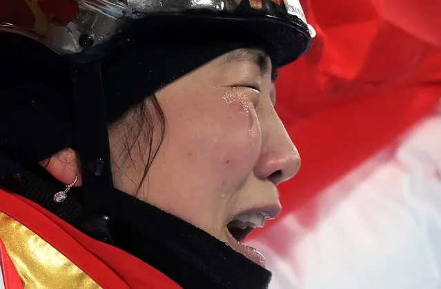 Gold medalist Xu Mengtao of China holds her national flag as she celebrates after winning the Women's Freestyle Skiing Aerials final at the Zhangjiakou Genting Snow Park at the Beijing 2022 Olympic Games, Beijing municipality, China, 14 February 2022. (Photo by Maxim Shipenkov/EPA/EFE/Rex Features/Shutterstock)
