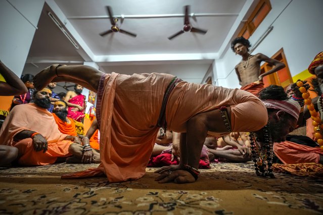 A Hindu holy man displays yoga skills on International Day of Yoga at the Kamakhya temple in Guwahati, Assam, India, Friday, June 21, 2024. (Photo by Anupam Nath/AP Photo)