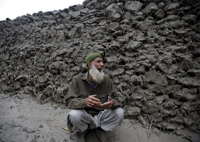A Kashmiri villager cries for his missing relative after a cloud burst at Kullan village in Ganderbal district, July 17, 2015. (Photo by Danish Ismail/Reuters)