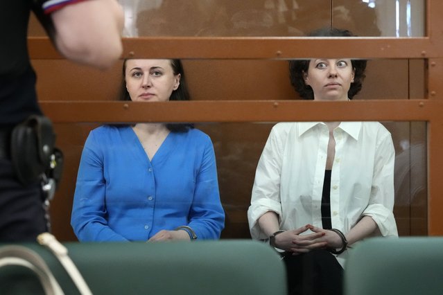 Theater director Zhenya Berkovich, right, and playwright Svetlana Petriychuk are seen in a glass cage prior to a hearing in a court in Moscow, Russia, Monday, July 8, 2024. A Russian court has convicted a theater director and a playwright of terrorism charges and sentenced them to six years prison. Zhenya Berkovich, a prominent independent theater director, and playwright Svetlana Petriychuk have already been jailed for over a year while awaiting trial. They have repeatedly rejected the accusations against them, the latest step in an unrelenting crackdown on dissent in Russia that has reached new heights since Moscow sent troops into Ukraine. (Photo by Alexander Zemlianichenko/AP Photo)