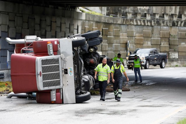 A transfer truck lies overturned on Independence Parkway in Tampa, as Hurricane Debby moves north of central Florida on August 5, 2024. (Photo by Octavio Jones/Reuters)