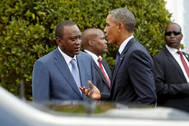 Kenya's President Uhuru Kenyatta (L) listens to U.S. President Barack Obama after their joint news conference at the State House in Nairobi July 25, 2015. (Photo by Jonathan Ernst/Reuters)
