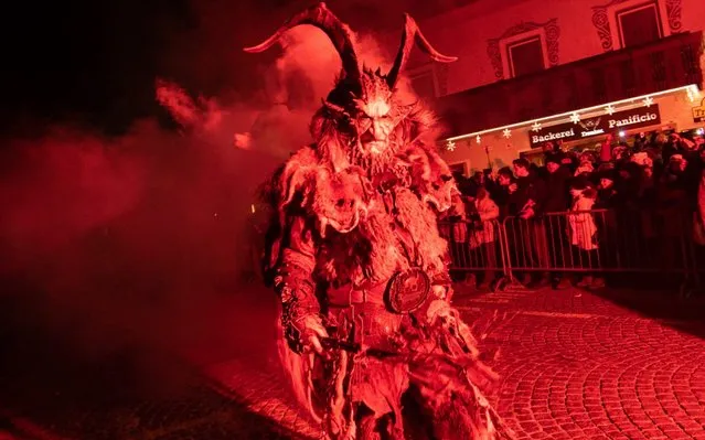 Performers dressed as the Krampus creature parade through the city center of Dobbiaco on December 07, 2019 in Bolzano, Italy. (Photo by Simone Padovani/Awakening/Getty Images)