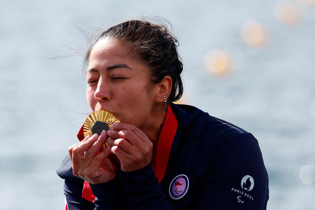 Katherinne Wollermann of Chile kisses her medal after winning gold in the women’s KL1 200m Kayak at Vaires-sur-Marne Nautical Stadium in Flatwater, Vaires-sur-Marne, France on September 8, 2024. (Photo by Gonzalo Fuentes/Reuters)