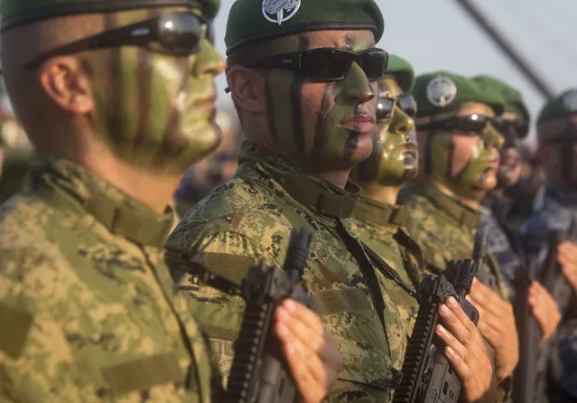 Croatian Army special forces troops march during a military parade marking the 20th anniversary of the “Operation Storm” that crushed Serb insurgency in Croatia, in Zagreb, Tuesday, August 4, 2015. (Photo by Darko Bandic/AP Photo)