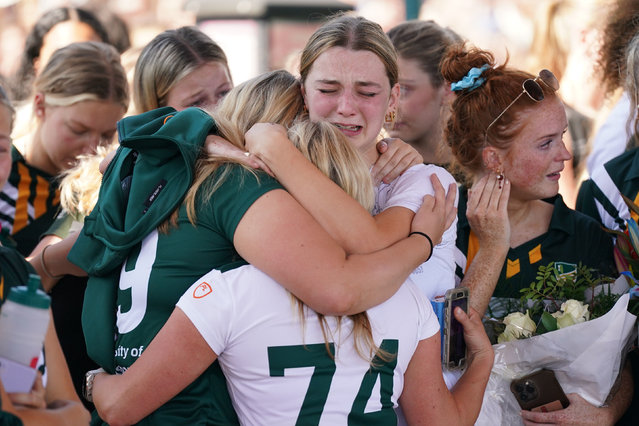 Grace O’Malley-Kumar’s hockey teammates attend a vigil at the University of Nottingham in Nottingham, England on June 14, 2023, after she and two others – fellow student Barnaby Webber and Ian Coates – were stabbed to death this week. The huge turnout at the vigil was testament to the impact the two students made in one academic year at the university – the two friends were excellent sportspeople, incredibly sociable and academically gifted. (Photo by Jacob King/PA Images via Getty Images)