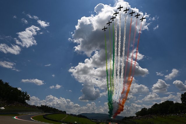 Italian Air Force's aerobatic demonstration team Frecce Tricolori performs prior to the Italian MotoGP race at Mugello Circuit in Mugello, on June 11, 2023. (Photo by Filippo Monteforte/AFP Photo)