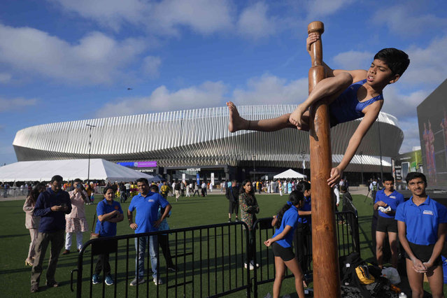 Suhrud Kamat, 11, top, practices the traditional Indian sport of mallakhamb outside the Nassau Coliseum before an event with Narendra Modi, Prime Minister of India, in Uniondale, N.Y., Sunday, September 22, 2024. (Photo by Seth Wenig/AP Photo)