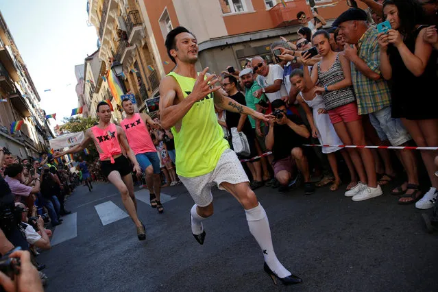 Competitors take part in the annual race on high heels during Gay Pride celebrations in the quarter of Chueca in Madrid, Spain, June 30, 2016. (Photo by Susana Vera/Reuters)