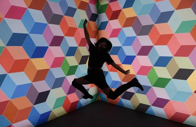 A woman poses for a picture during the pre-opening party at The WOW! Gallery Berlin, an interactive pop-up selfie museum in Berlin, Germany, February 13, 2020. (Photo by Annegret Hilse/Reuters)