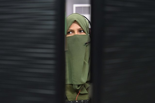 A female staff of the Sindh Rescue 1122 handles calls at 1122 headquarters in Karachi, Pakistan, 02 October 2024. In a big step for women's representation in Pakistan, about 20 women firefighters have joined the Rescue 1122 service in Karachi, a historic moment in a field that has mostly been dominated by men. These women have participated in numerous firefighting operations since their induction. The Rescue 1122 service now includes 72 women actively involved in various emergency response tasks, showcasing that women can excel in challenging roles traditionally held by men. These trailblazing women encourage more females to join the firefighting profession, emphasizing that “what men can do, women can also do”. (Photo by Shahzaib Akber/EPA/EFE)