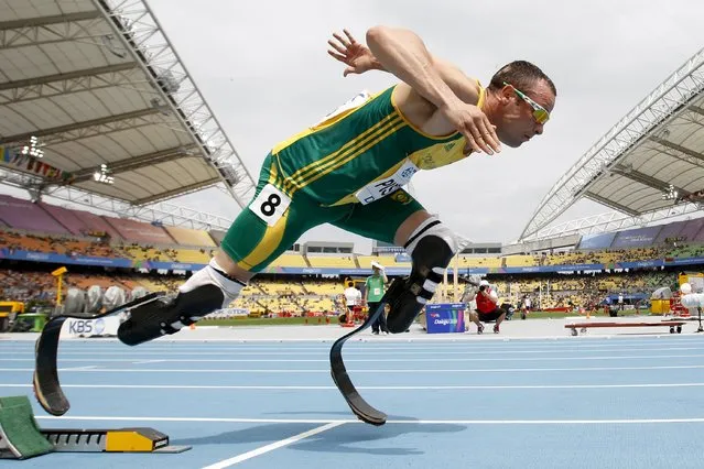 Oscar Pistorius of South Africa comes out of the starting blocks during his men's 400 metres heat at the IAAF World Championships in Daegu in this August 28, 2011 file photo. Pistorius is due to be released on Friday after serving 10 months of a five-year sentence, in line with South Africa's custodial guidelines for non-dangerous prisoners. (Photo by Max Rossi/Reuters)