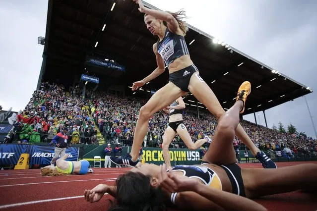 Morgan Uceny, top, steps over Brenda Martinez at the finish line in the finals of the women's 1500-meter run with  at the U.S. Olympic Track and Field Trials, Sunday, July 10, 2016, in Eugene Ore. (Photo by Matt Slocum/AP Photo)