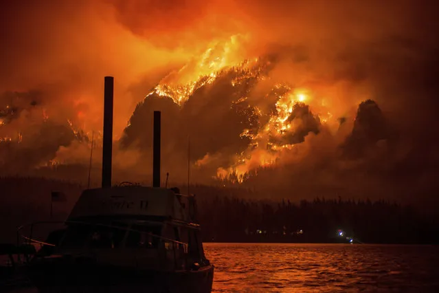 This Monday September 4, 2017, photo provided by KATU-TV shows the Eagle Creek wildfire as seen from Stevenson Wash., across the Columbia River, burning in the Columbia River Gorge above Cascade Locks, Ore. A lengthy stretch of highway Interstate 84 remains closed Tuesday, Sept. 5, as crews battle the wildfire that has also caused evacuations and sparked blazes across the Columbia River in Washington state. (Photo by Tristan Fortsch/KATU-TV via AP Photo)