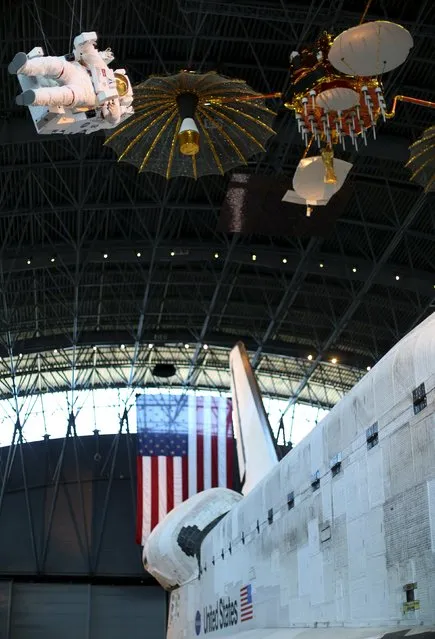 The space shuttle orbiter Discovery (R) is seen on display at the Udvar-Hazy Smithsonian National Air and Space Annex Museum in Chantilly, Virginia August 28, 2015. (Photo by Gary Cameron/Reuters)