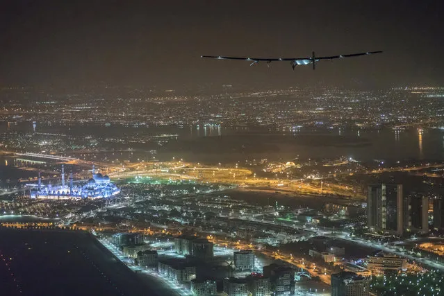Solar Impulse 2, the solar powered plane, piloted by Swiss pioneer Bertrand Piccard, is seen before landing in Abu Dhabi to finish the first around the world flight without the use of fuel, United Arab Emirates, July 26, 2016. (Photo by Jean Revillard/Bertrand Piccard/Reuters/SI2)