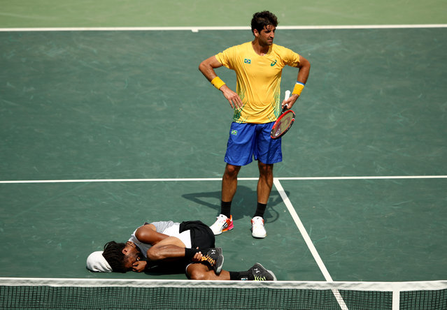 Dustin Brown of Germany hurts his ankle during his match against Thomaz Bellucci of Brazil in their first round match on Day 2 of the Rio 2016 Olympic Games at the Olympic Tennis Centre on August 7, 2016 in Rio de Janeiro, Brazil. (Photo by Cameron Spencer/Getty Images)