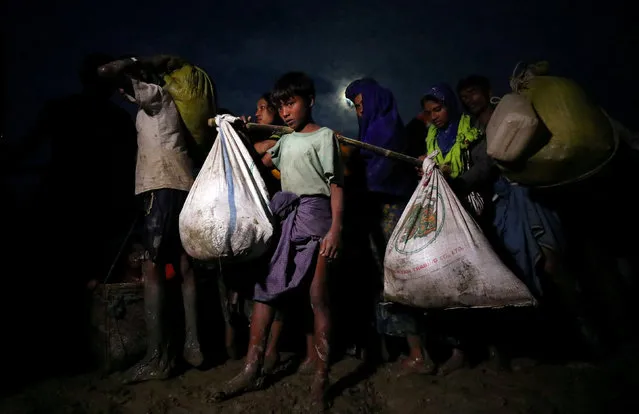 Rohingya refugees continue their journey after crossing the Myanmar-Bangladesh border in Palong Khali, Bangladesh, November 1, 2017. (Photo by Hannah McKay/Reuters)