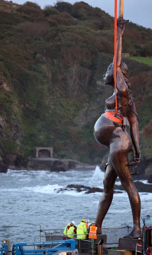 Damien Hirst's Giant Bronze Sculpture Of A Pregnant Woman “Verity” Is Erected In Ilfracombe
