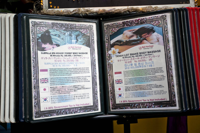A list of treatments is displayed in front of the Bali Heritage Reflexology and Spa on October 27, 2013 in Jakarta, Indonesia. (Photo by Ulet Ifansasti/Getty Images)