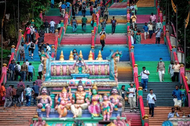 Hindus arriving from Malaysia andneighboring countries are gathered at the Batu Caves to perform a morning prayer ceremony and celebrate the first day of the Diwali festival in Malaysia on October 24, 2022. Diwali also known as Deepavali, and the '“festival of lights'”, is one of the most popular festivals of Hinduism. It symbolizes the spiritual “victory of light over darkness, good over evil, and knowledge over ignorance”. (Photo by Syaiful Redzuan/Anadolu Agency via Getty Images)