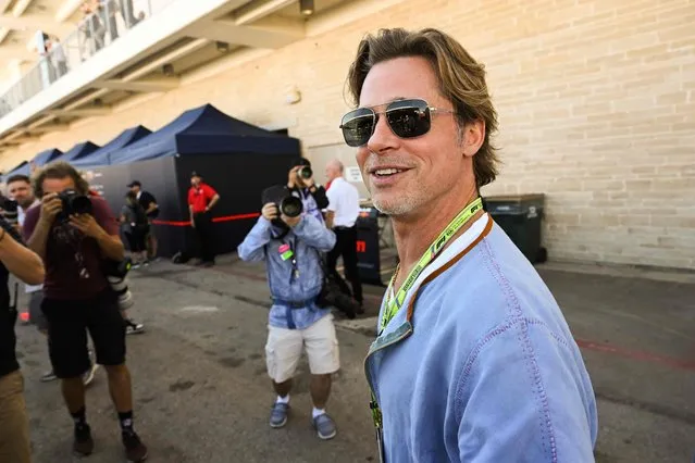US actor Brad Pitt tours the paddock before the Formula One United States Grand Prix practice session at the Circuit of the Americas in Austin, Texas, on October 21, 2022. (Photo by Patrick T. Fallon/AFP Photo)