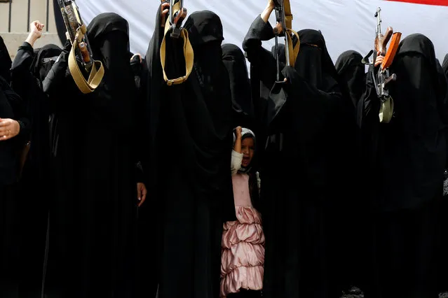 A girl attends a parade held by women loyal to the Houthi movement to show support to the movement in Sanaa, Yemen September 7, 2016. (Photo by Khaled Abdullah/Reuters)