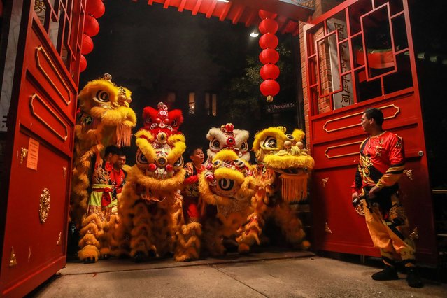 Lion dance group from Australian Yau Kung Mun Association prepare before perform at Sze Yup Kwan Ti temple during Lunar New Year's Eve celebration on February 09, 2024 in Sydney, Australia. Lunar New Year was observed at the heritage-listed Sze Yup Kwan Ti temple in inner-west Sydney. The Taoist temple in Glebe dates back to 1898 and is one of only four pre-WWI Chinese temples still active in Australia. The temple hosted a traditional lion dance to welcome in the Year of the Dragon on the eve of Lunar New Year, also known as Chinese New Year. The day is celebrated around the world, and The Year of the Wood Dragon in 2024 is associated with growth, progress, and abundance, as wood represents vitality and creativity, while the dragon symbolizes success, intelligence, and honor. (Photo by Roni Bintang/Getty Images)