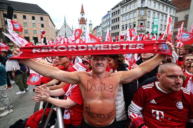 A fan holds a scarf reading “record champion” and has written “thank you, Thomas” on his body at the champion celebration at the City Hall at Marienplatz Square in Munich, Germany, 18 May 2025. FC Bayern Munich is the German Bundesliga Champion for the 2024/25 season. (Photo by Anna Szilagyi/EPA/EFE)