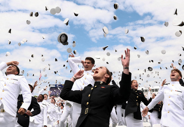 Graduates toss their caps in the air upon the conclusion of the Graduation and Commissioning Ceremony at the U.S. Naval Academy in Annapolis, Maryland, U.S., May 23, 2025. (Photo by Kevin Lamarque/Reuters)