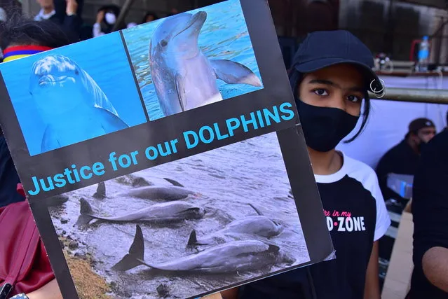 Tens of thousands of people protest in Port Louis, Mauritius, Saturday August 29, 2020, over the government's slow response to an oil spill from a grounded Japanese ship and the alarming discovery of dozens of dead dolphins. (Photo by Beekash Roopun/L'express Maurice via AP Photo)