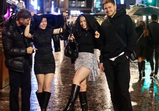 Couples enjoying their night out to celebrate the end of 2023 in Leeds, United Kingdom on December 31, 2023. (Photo by Nb press ltd)