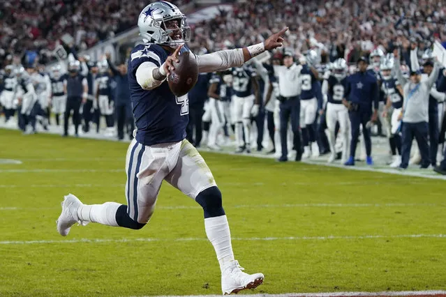 Dallas Cowboys quarterback Dak Prescott (4) runs into the end zone on a touchdown carry during the first half of an NFL wild-card football game against the Tampa Bay Buccaneers, Monday, January 16, 2023, in Tampa, Fla. (Photo by John Raoux/AP Photo)