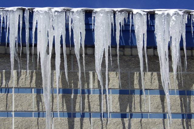 Icicles hang from Captain Jack's Liquor Land in Bismarck, N.D., on Tuesday, February 18, 2025. (Photo by Jack Dura/AP Photo)
