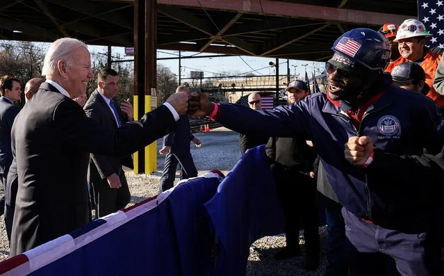 U.S. President Joe Biden receives a fist bump as he departs after delivering remarks touting Infrastructure Law spending to replace the Baltimore and Potomac railroad tunnel with the Frederick Douglass Tunnel project, at an event in Baltimore, Maryland, U.S., January 30, 2023. (Photo by Kevin Lamarque/Reuters)