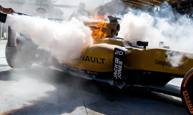 Kevin Magnussen of Renault and Denmark catches fire during practice for the Malaysia Formula One Grand Prix at Sepang Circuit on September 30, 2016 in Kuala Lumpur, Malaysia. (Photo by Peter J. Fox/Getty Images)