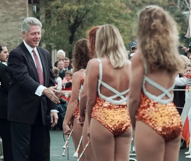 President Clinton greets a group of majorettes from the University of Tennessee after arriving in Knoxville, Tenn. Thursday October 10, 1996. (Photo by Greg Gibson/AP Photo)