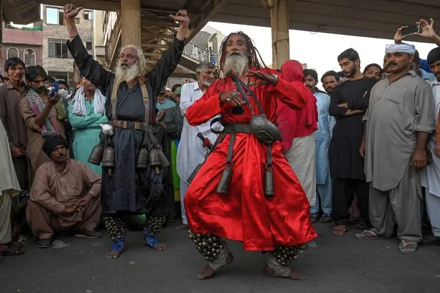 Devotees perform at the Data Darbar Shrine on the second day of a three-day annual Sufi religious festival called “Urs” in Lahore on October 7, 2020. The Data Darbar complex contains the shrine of Saint Syed Ali bin Osman Al-Hajvery, popularly known as Data Ganj Bakhsh. (Photo by Arif Ali/AFP Photo)