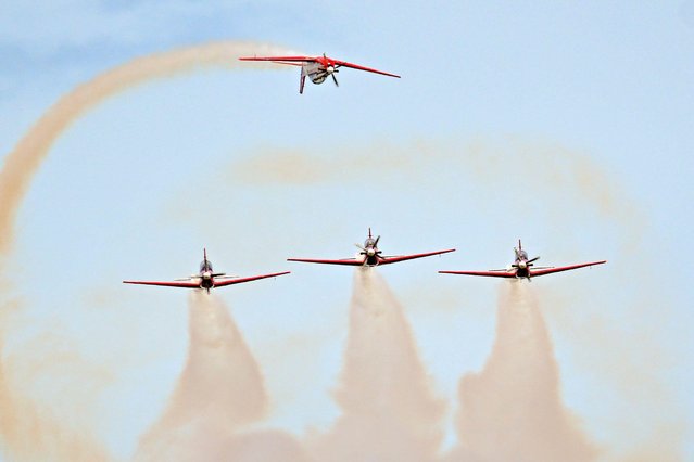 Jupiter Aerobatic Team performs an aerobatic show at the opening ceremony of the 17th edition of the Langkawi International Maritime and Aerospace Exhibition (LIMA) in Langkawi, Malaysia, May 20, 2025. (Photo by Cheng Yiheng/Xinhua/Alamy Live News)