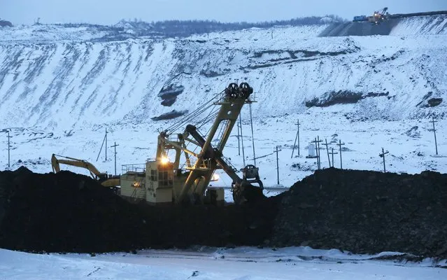 A dredge works on the coal face of the Borodinsky opencast colliery, near the Siberian town of Borodino, east of Krasnoyarsk, December 9, 2014. (Photo by Ilya Naymushin/Reuters)