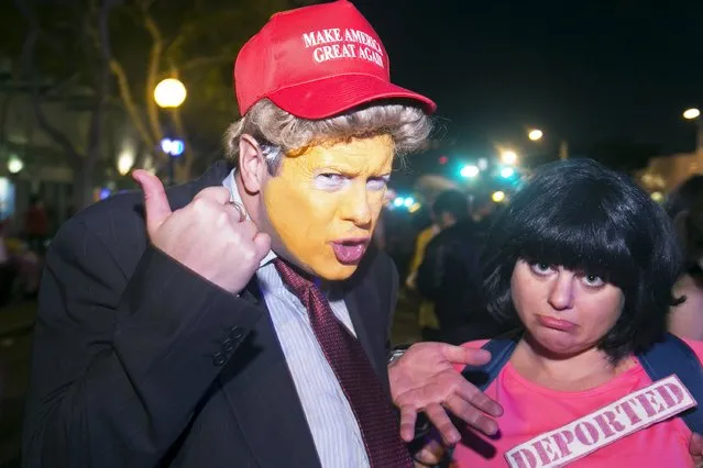 Robi Collins dressed as Donald Trump and Naomi Leonard pose at the West Hollywood Halloween Costume Carnaval, which attracts nearly 500,000 people annually, in West Hollywood, California October 31, 2015. (Photo by Jonathan Alcorn/Reuters)