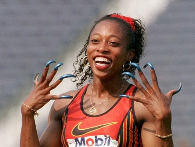 Gail Devers shows-off her nails after winning the women's 100-meter hurdles final at the U.S. Olympic team trials in Atlanta, Sunday, June 23, 1996. (Photo by Rick Bowmer/AP Photo)